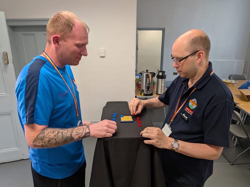 Two adults playing LEGO noughts and crosses at Darlington Brick Show 2026